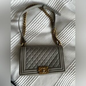 Beautiful rare grey caviar Chanel boy bag with gold hardware. Good condition.